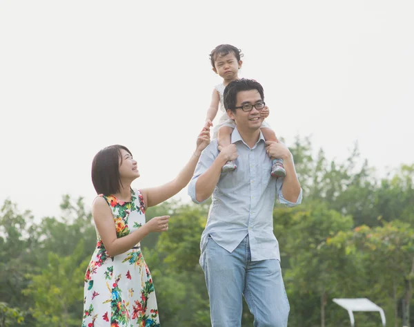 Happy Asian Family  in the park