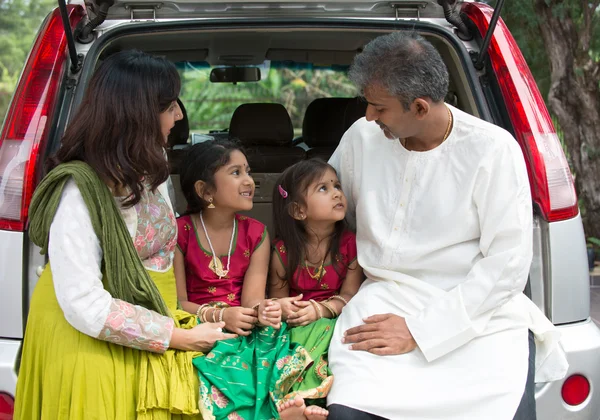 Happy   Indian family sitting in car