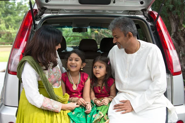 Happy   Indian family sitting in car