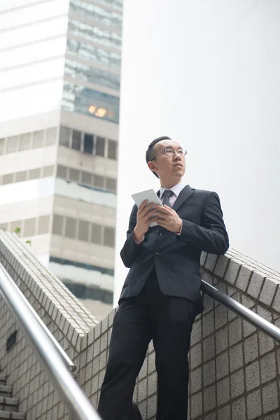 Chinese businessman with tablet computer