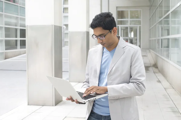 Indian male with laptop