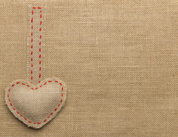 Heart Shape Sackcloth Sewing Object. Mended Burlap Background. Valentine Day Burlap or Wedding Love concept.