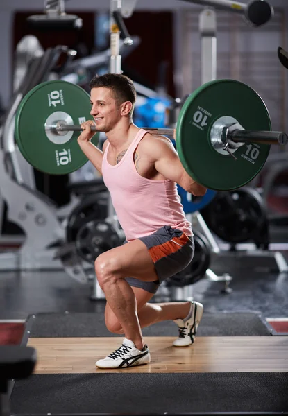 Man doing barbell lunges