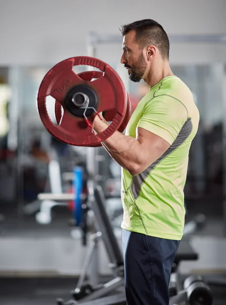 Man doing barbell biceps curl