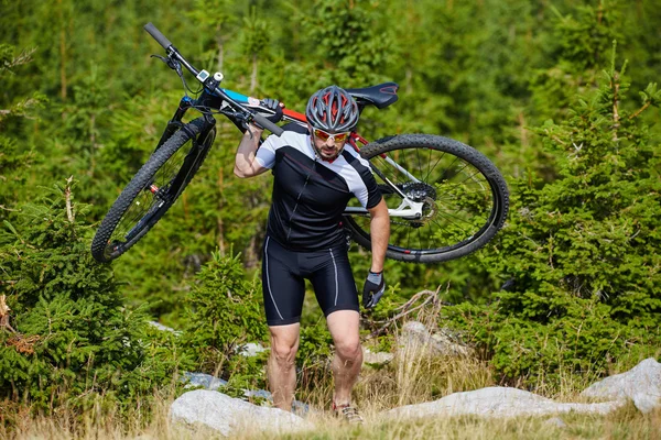 Bike cyclist carrying bike