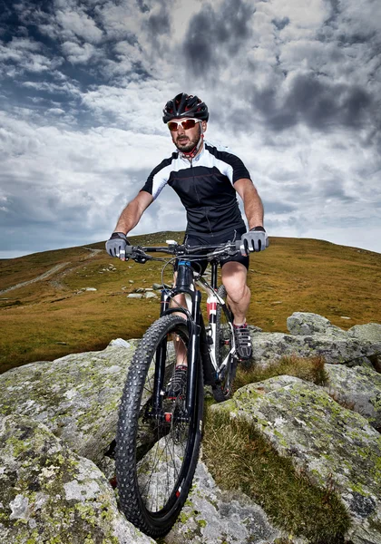 Cyclist  riding on rugged trails