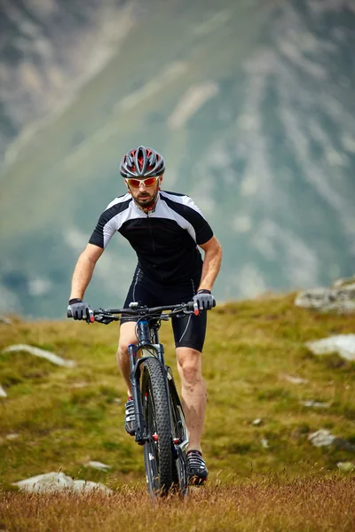 Cyclist  riding on rugged trails