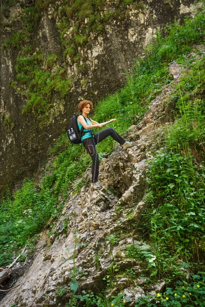 Woman climbing on a mountain