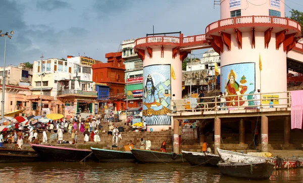 People wade in water during a religious ceremony