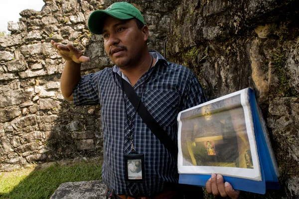 Tour guide talks to tourists at Chiapas in Mexico