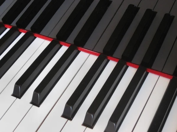 Closeup of piano keys, close frontal view