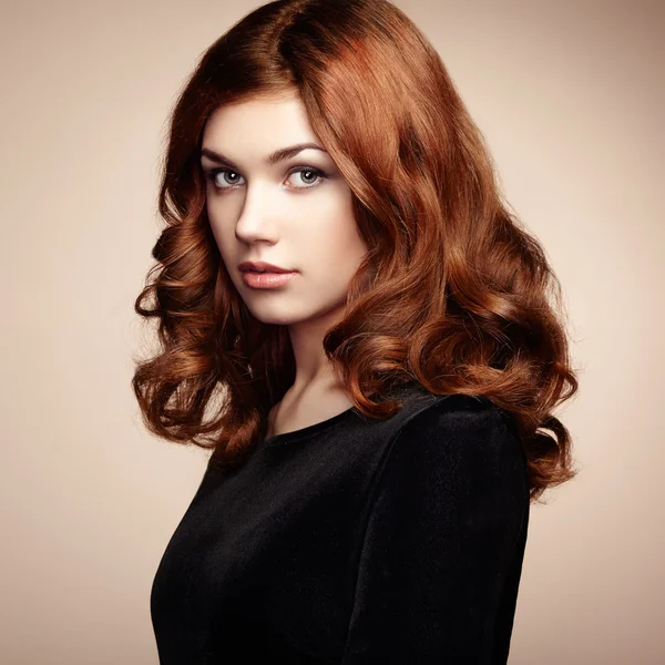 Fashion portrait of elegant woman with magnificent hair