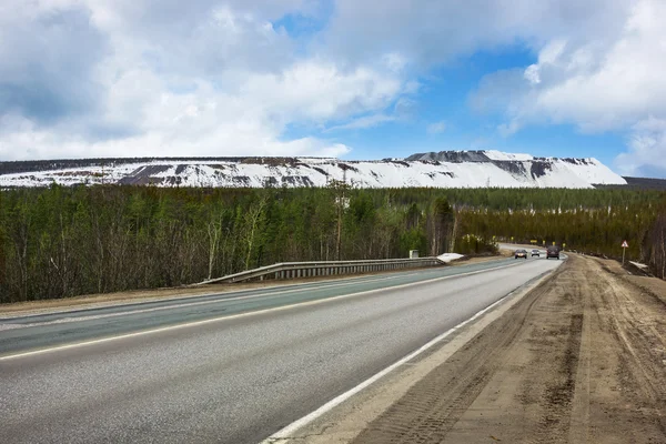 Road, Murmansk region, Russia. Spring