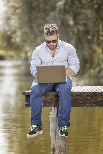 Young bearded man with a notebook