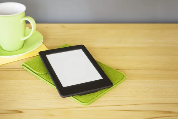 Ebook reader on wooden table