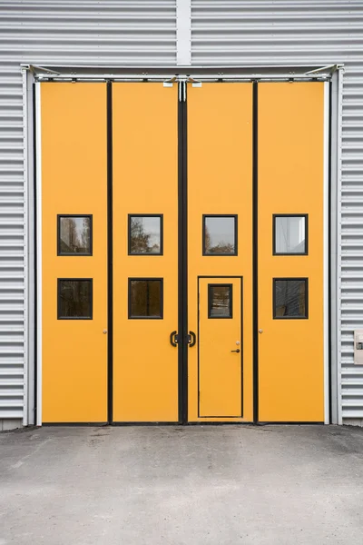 Orange Garage Door on a warehouse building