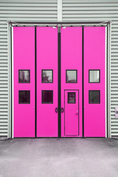 Pink Garage Door on a warehouse building