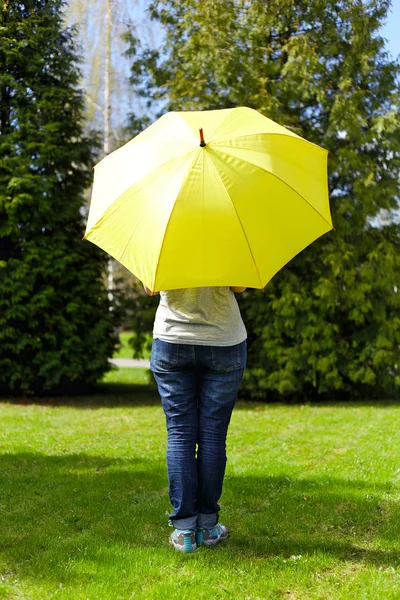Young woman under umbrella