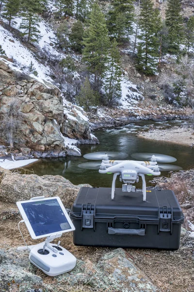 Drone taking off in river canyon