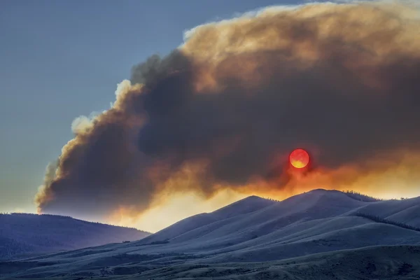 Sunset obscured by wildfire smoke