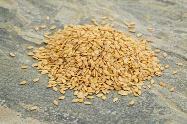 Heap of gold flax seeds