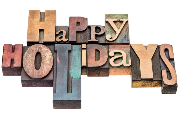 Happy Holidays greetings in wood type