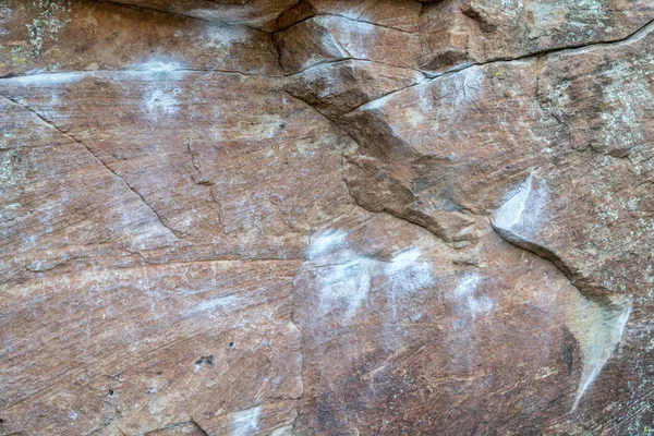Climbing wall with white chalk marks