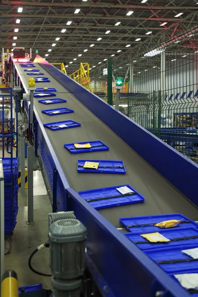 Parcels traveling on the conveyor belt in Logistics center