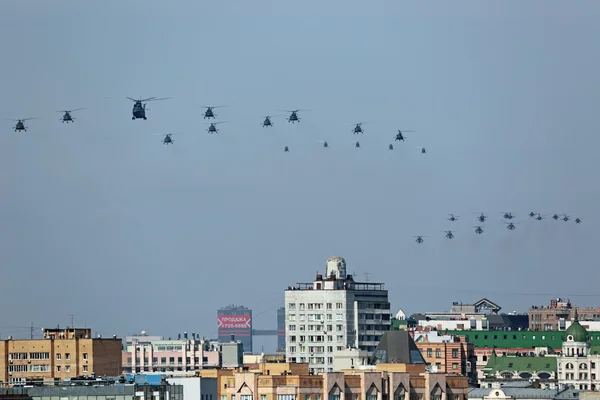 Group of military helicopters in sky