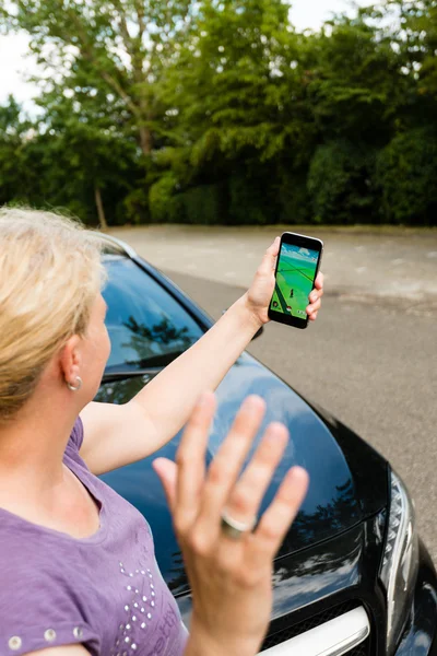 Pedestrian being hit by car while playing Pokemon Go on her smartphone