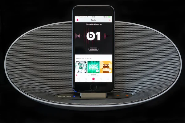 IPhone 6 with loudspeaker displaying the Apple Music radio screen