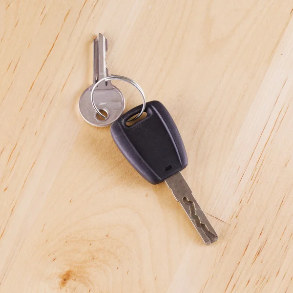 Car key over wooden table
