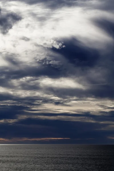 Dramatic Evening Clouds Over Calm Ocean Depoe Bay Oregon