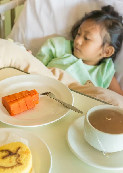 Sick Asian Child Hospital Patient on Bed with Fruit Menu Served on Bed