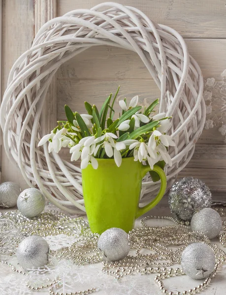 Bouquet of snowdrops and tree toy