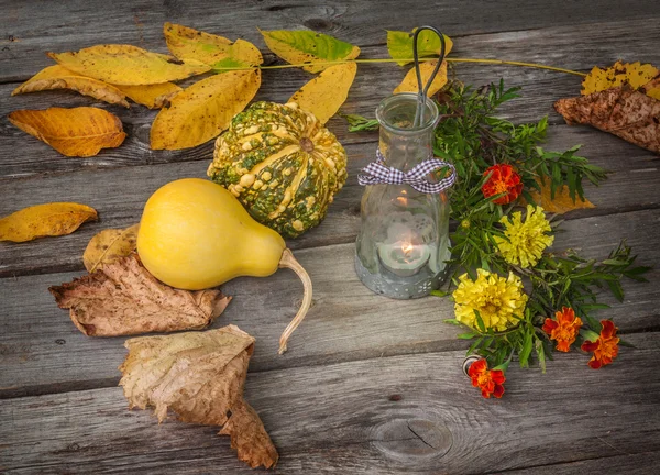 Lamp, pumpkins and leaves