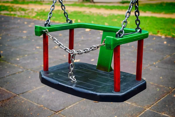 Empty swings on playground