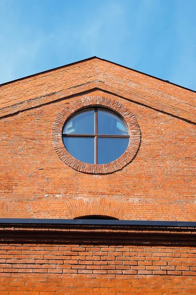 Brick building with a round window