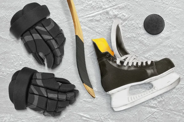 Hockey skates, stick, gloves and puck