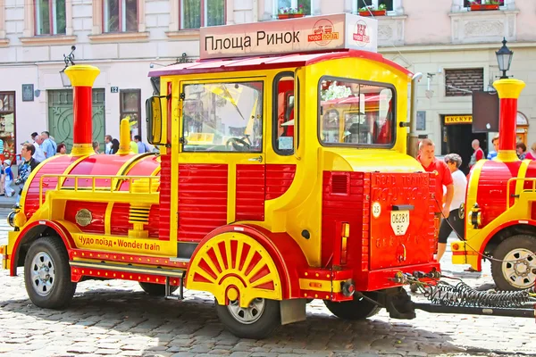 Sightseeing car train  in the center of Lviv, Market square, Ukraine