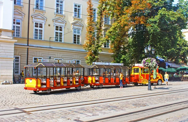 Sightseeing car train  in the center of Lviv, Market square, Ukraine