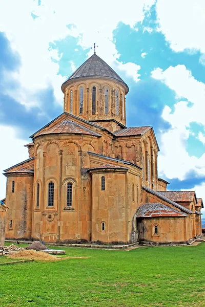 Tower of Gelati Monastery in the rainy weather, Georgia. It contains the Church of the Virgin founded by the King of Georgia David the Builder in 1106, and the 13th-century churches of St George and St Nicholas