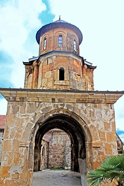 Tower of Gelati Monastery in the rainy weather, Georgia. It contains the Church of the Virgin founded by the King of Georgia David the Builder in 1106, and the 13th-century churches of St George and St Nicholas