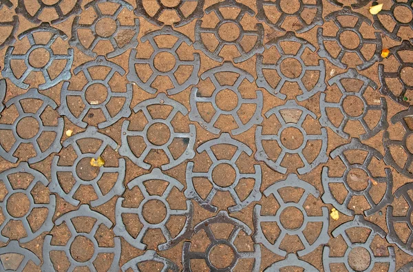 Cast iron pavement on Ancor square  in Kronstadt, Russia. The cast-iron pavement on Anchor Square with length of 200 meters