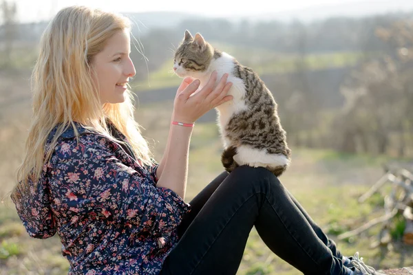 Blonde woman with cat