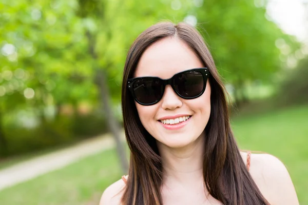 Summer girl portrait. Asian woman smiling happy on sunny summer day