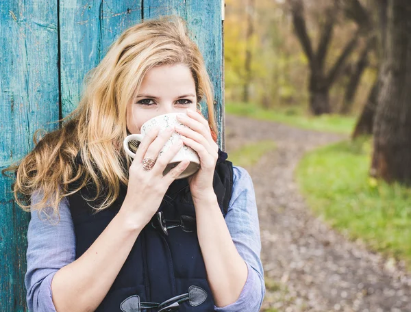 Autumn woman drinking coffee.
