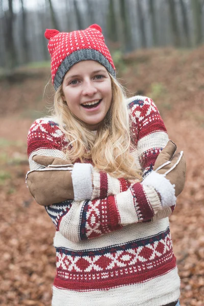 Young blonde woman in warm clothes