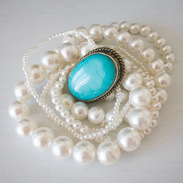 Jewel with turquoise stone and pearl necklace