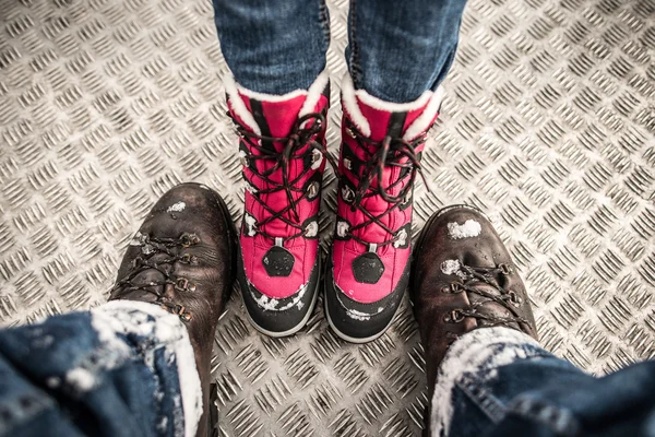 Hiking boots. Couple traveling together.